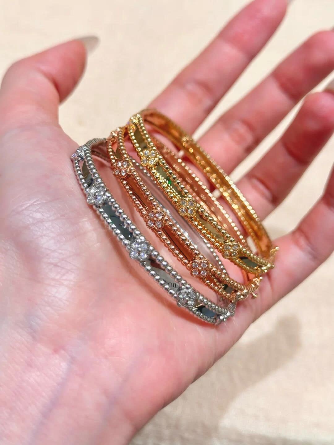 Van Cleef & Arpels Elegant Gold and Silver Bracelets Set